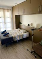 Postel nebo postele na pokoji v ubytování Green Oasis Apartment - Orlandito