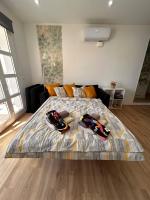 Postel nebo postele na pokoji v ubytování Green Oasis Apartment - Orlandito