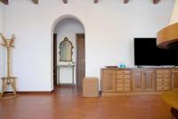 Televízia a/alebo spoločenská miestnosť v ubytovaní Villa Olga Lago Maggiore