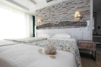 Postel nebo postele na pokoji v ubytování Dedeminn Marina Hotel