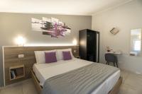 A bed or beds in a room at Affittacamere Orchidea for Tourists Hesperia Hosp