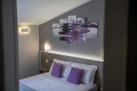 A bed or beds in a room at Affittacamere Orchidea for Tourists Hesperia Hosp