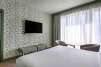 Televízia a/alebo spoločenská miestnosť v ubytovaní AC Hotel Ciudad de Sevilla by Marriott