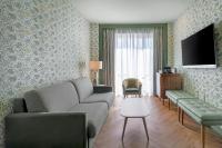 Televízia a/alebo spoločenská miestnosť v ubytovaní AC Hotel Ciudad de Sevilla by Marriott