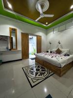 a bedroom with a bed and a ceiling fan at Malas Island View in Fulidhoo