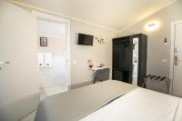 A bed or beds in a room at Affittacamere Orchidea for Tourists Hesperia Hosp