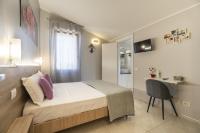 A bed or beds in a room at Affittacamere Orchidea for Tourists Hesperia Hosp