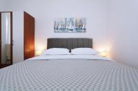 Postel nebo postele na pokoji v ubytování Apartments Villa Flamingo