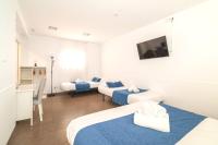 Posteľ alebo postele v izbe v ubytovaní Laramond Barcelona Rooms