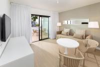 a living room with a couch and a table at Sol Fuerteventura Jandia - All Suites in Morro del Jable