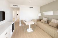 a living room with a couch and a table at Sol Fuerteventura Jandia - All Suites in Morro del Jable