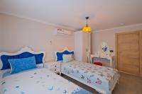 Postel nebo postele na pokoji v ubytování Villa Sea Renity