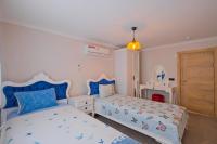 Postel nebo postele na pokoji v ubytování Villa Sea Renity