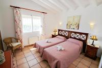 A bed or beds in a room at Marcelo - charming, Finca style holiday villa in Moraira