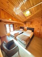 A bed or beds in a room at Ozkan Otel