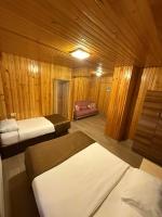 A bed or beds in a room at Ozkan Otel