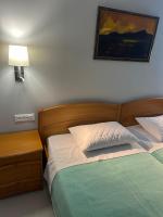 Posteľ alebo postele v izbe v ubytovaní Nektar Beach Hotel