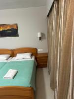 Posteľ alebo postele v izbe v ubytovaní Nektar Beach Hotel