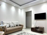 TV a/nebo společenská místnost v ubytování El Lotus Building