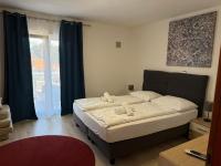 Posteľ alebo postele v izbe v ubytovaní Apartments Puntamika