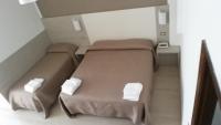 A bed or beds in a room at Hotel Villa Alberta B&B