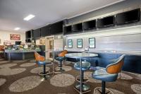 a bar withools and a table in a restaurant at Euroa Hotel in Euroa