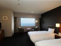 Imazu Sun Bridge Hotelにあるベッド