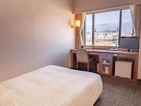 Imazu Sun Bridge Hotelにあるベッド