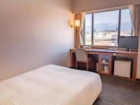 Imazu Sun Bridge Hotelにあるベッド