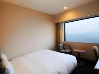 Imazu Sun Bridge Hotelにあるベッド