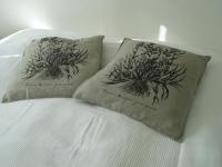 a bed with two pillows on top of it at Aalborg City Rooms ApS in Aalborg