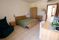 A bed or beds in a room at Hotel San Remo