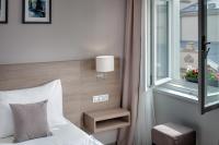 a bedroom with a bed and a window at Hotel Florenc in Prague
