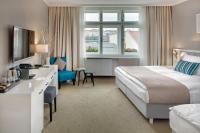a hotel room with a bed and a desk at Hotel Florenc in Prague