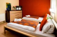 Postel nebo postele na pokoji v ubytování Hotel Bystricka
