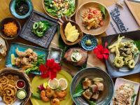 a table with many plates of food on it at MORIYA iriomote HOTEL in Urauchi