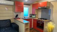 Kuchyňa alebo kuchynka v ubytovaní Mobil home Les Sables d'Or Agde