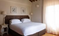 A bed or beds in a room at Poggio al Casone