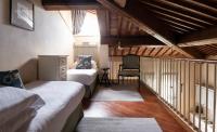 A bed or beds in a room at Poggio al Casone