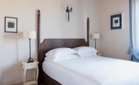A bed or beds in a room at Poggio al Casone