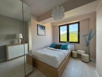 Posteľ alebo postele v izbe v ubytovaní Apartamenty City Center - Zdrojowe