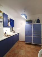 Kuchyňa alebo kuchynka v ubytovaní Casa blue fish