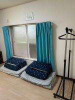 Ein Bett oder Betten in einem Zimmer der Unterkunft ハイツドリーム梦想小屋