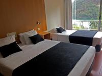 Postel nebo postele na pokoji v ubytování Hotel Eco Salvador