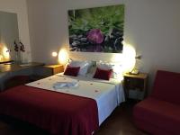 Postel nebo postele na pokoji v ubytování Hotel Eco Salvador