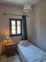 Posteľ alebo postele v izbe v ubytovaní Eleana apartments and studios