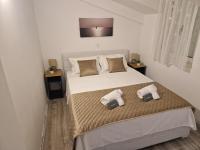 Posteľ alebo postele v izbe v ubytovaní Apartments MB