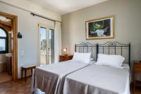 A bed or beds in a room at Liostasi