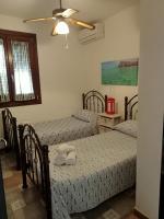 A bed or beds in a room at VILLA TREROSE by Trerose Properties - Villa centrale con wi-fi e posto auto privato gratuiti