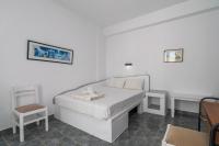 Posteľ alebo postele v izbe v ubytovaní Apollon Rooms